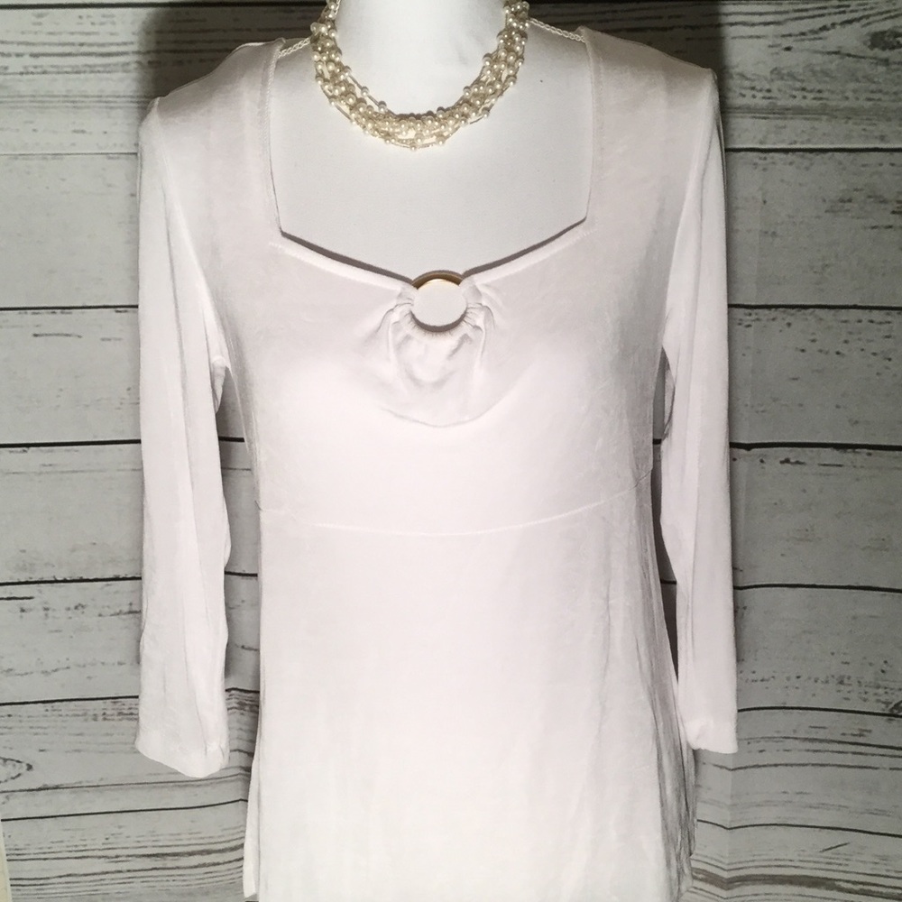 Slinky white shirt with gold hardware at neckline