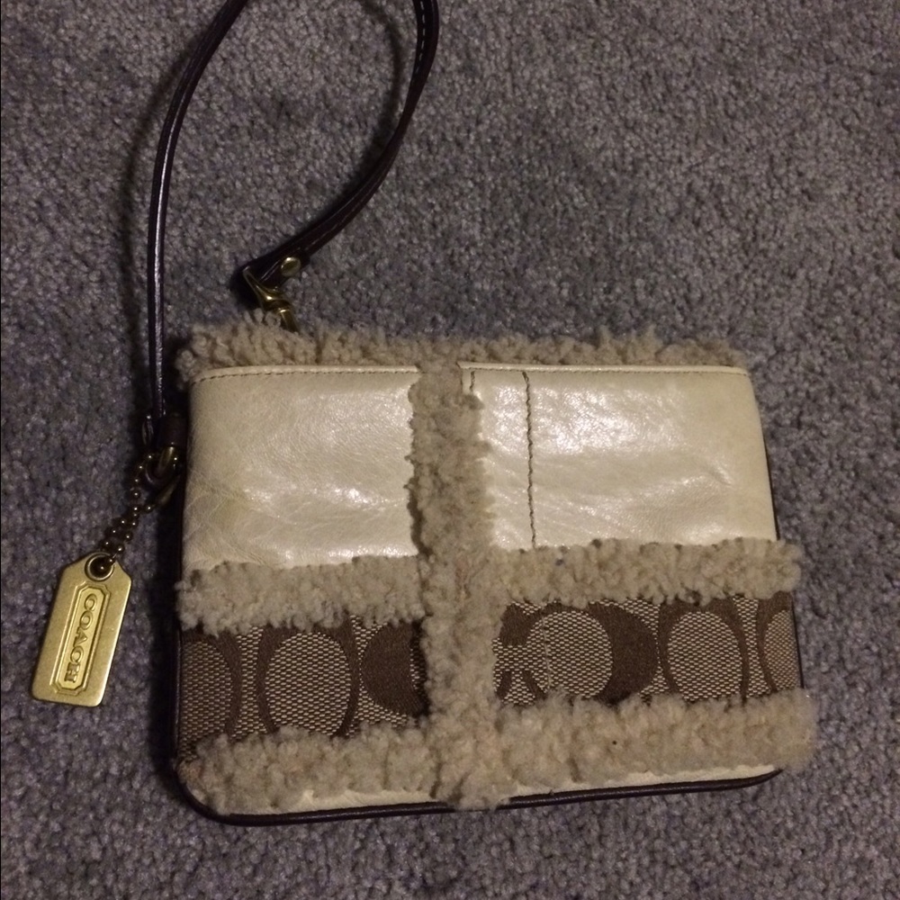 Coach wristlet with fur