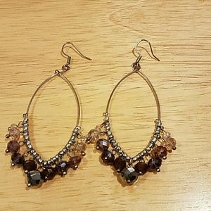 Dangly beaded earrings in shades of purple