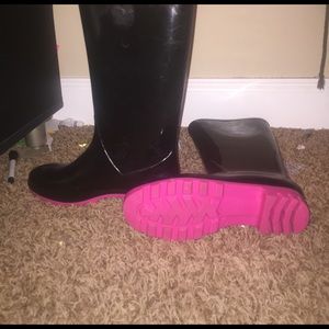 Black and pink rain boots