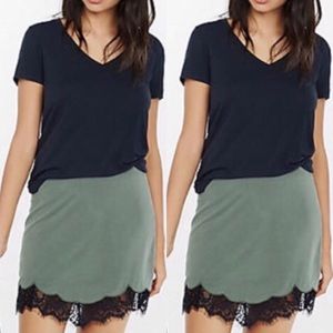 Olive green mini skirt with black lace trim