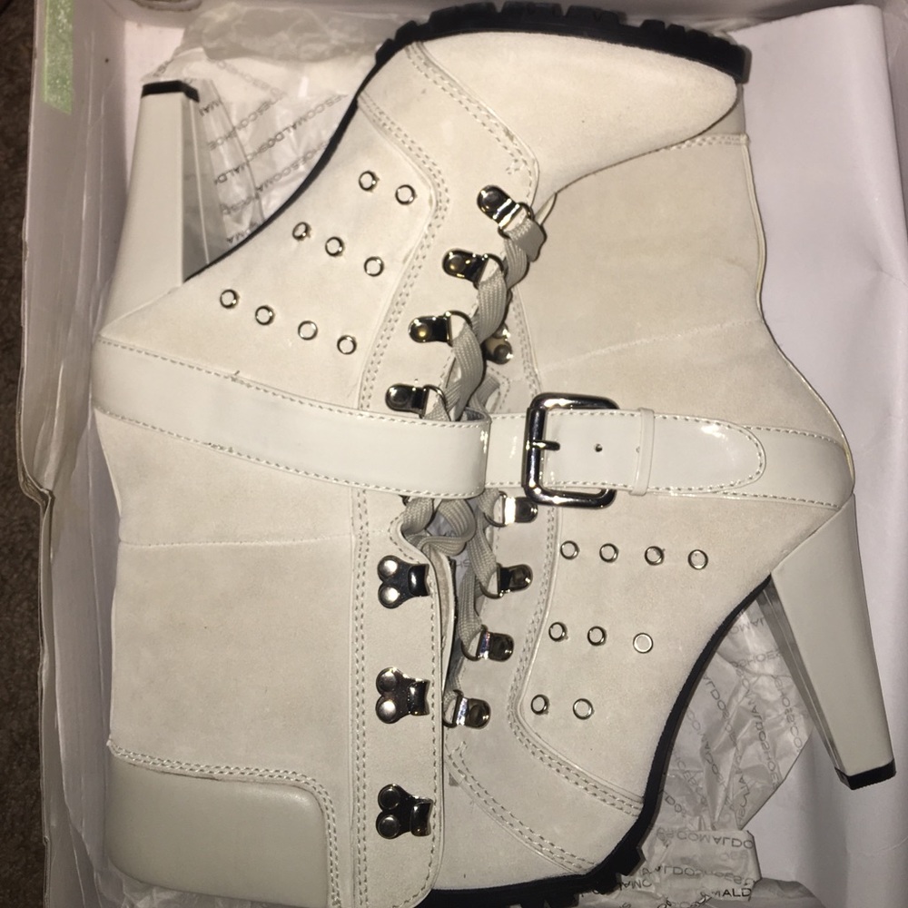 White and black Aldo boots.