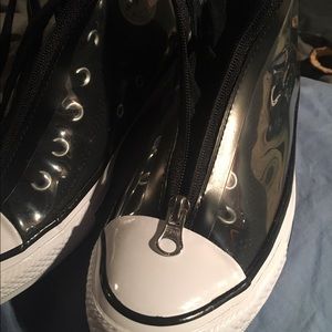 Black hightop converse with plastic zip over
