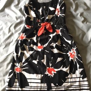 Black, white, and red flowered dress with red tie