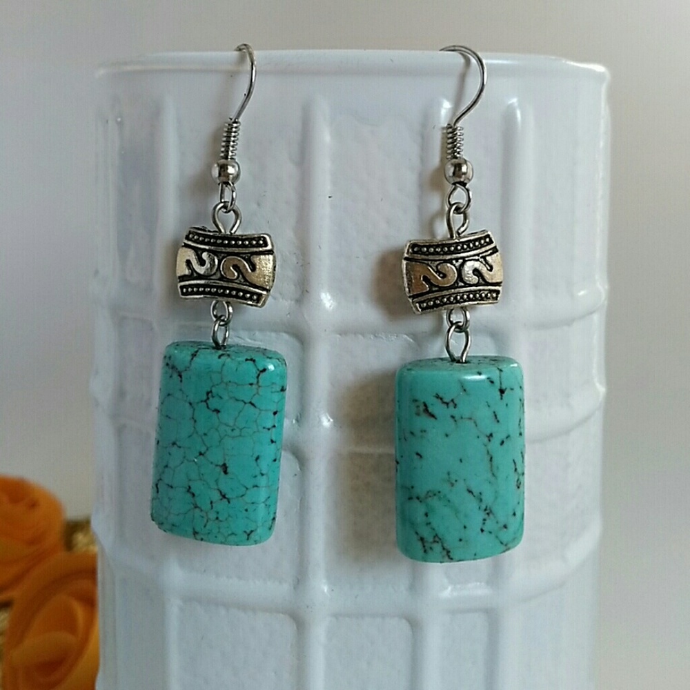 Silver and turquoise colored earrings