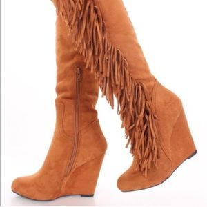 Tall brown fringe boots