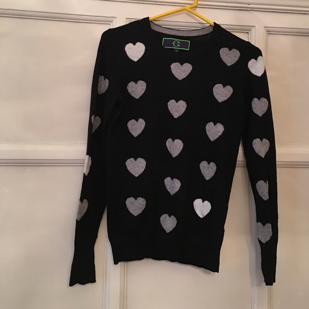 Black sweater with grey hearts.