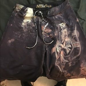 Pair of brown Affliction swim trunks