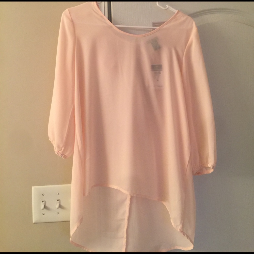 Sheer high low top with accent bow