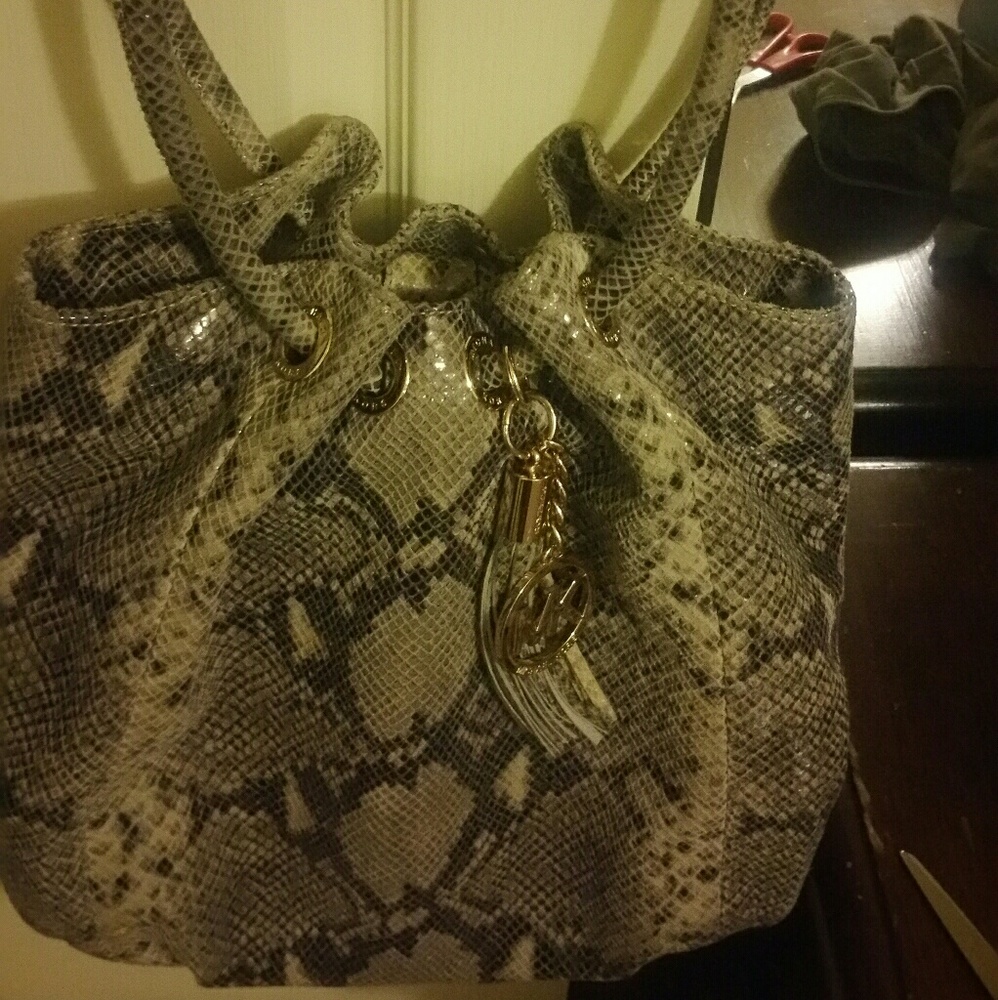 SOLD.  AUTH MK SNAKE SKIN collection