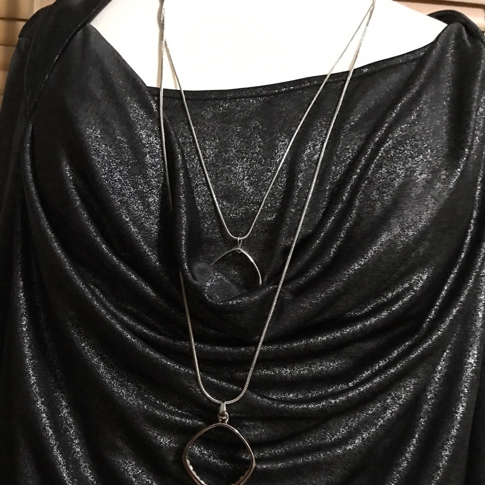 Silky black shirt and grey pants