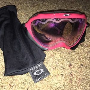 Pink Oakley snow goggles.