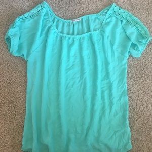 Turquoise blouse.