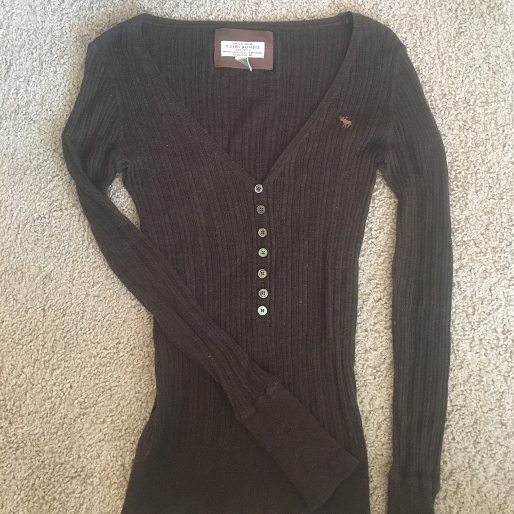 Brown long sleeve sweater.