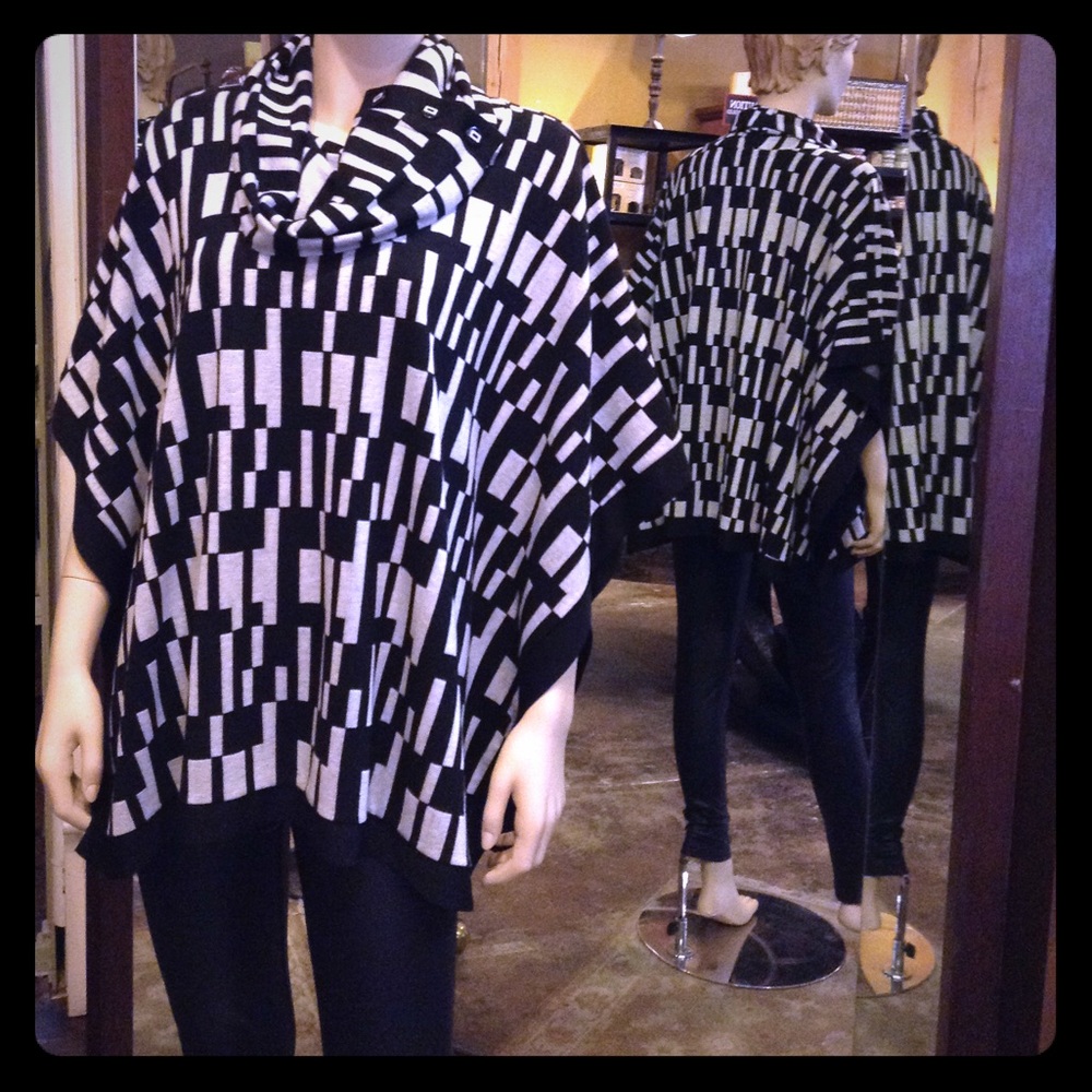 Cowl neck, black and white cape.
