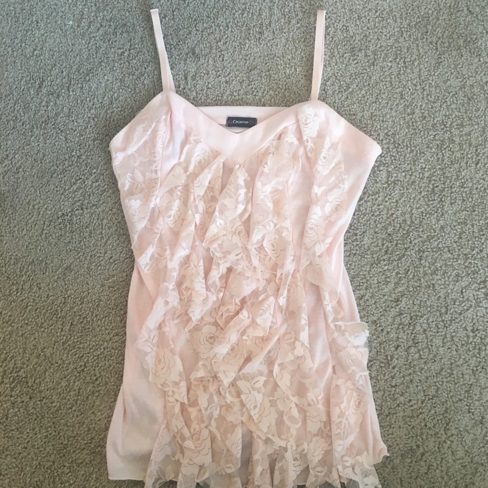 Peach colored blouse.