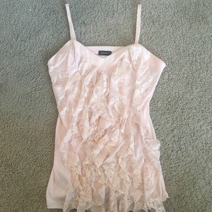 Peach colored blouse.