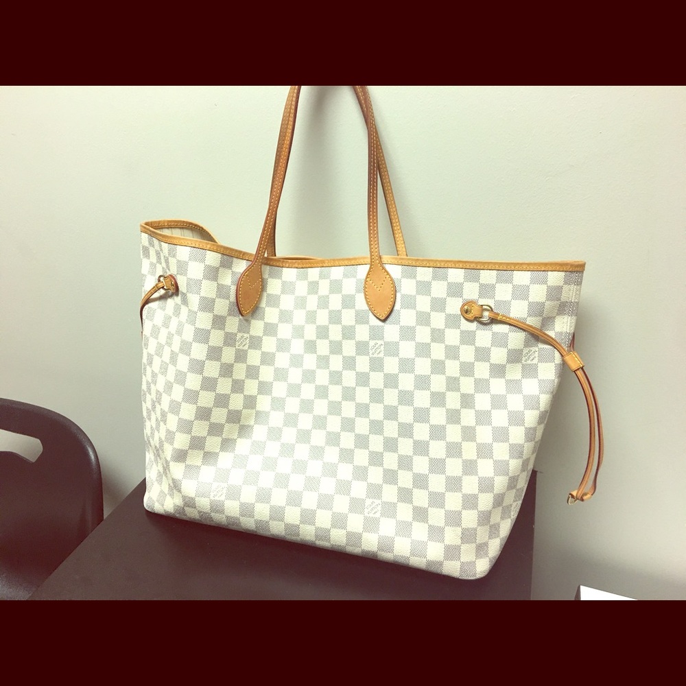 Authentic Louis Vuitton with matching clutch