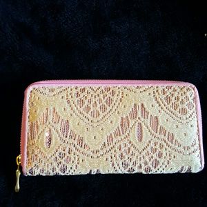 Tan with pink sequence underneath wallet