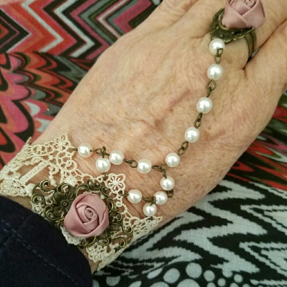 Slave chain bracelet with attached ring
