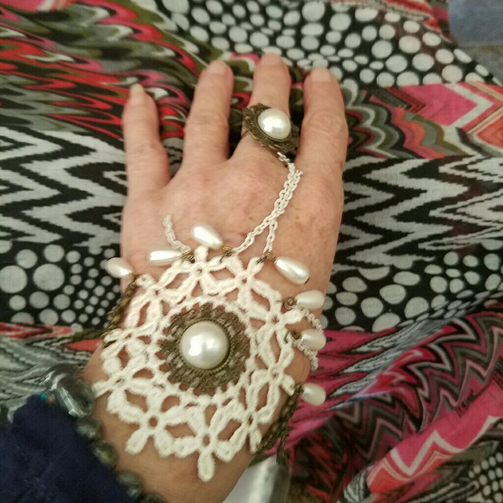 Wrist slave chain bracelet with ring attached