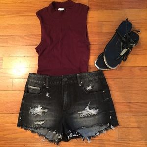 Destroyed black jean shorts