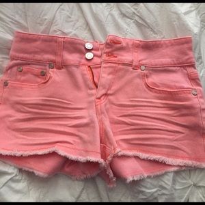 Coral colored jean shorts