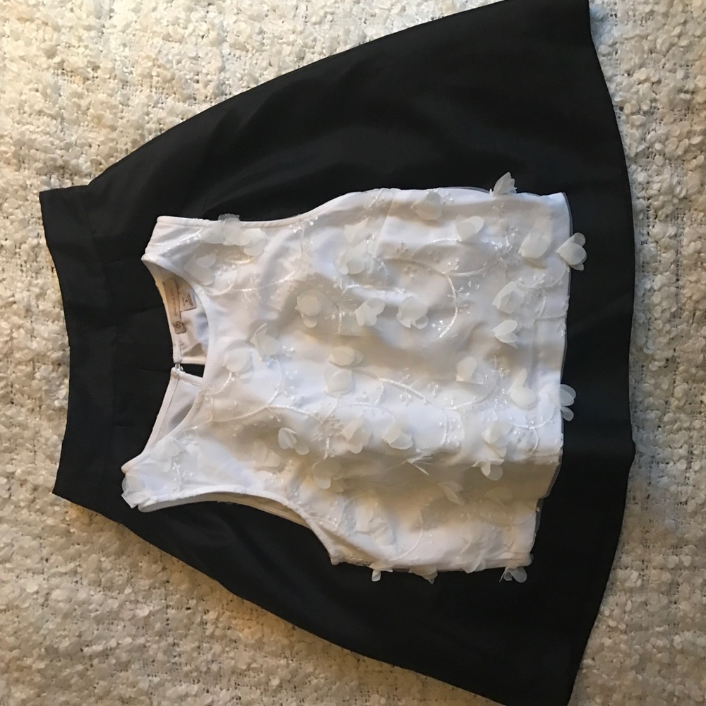 Floral white crop top and black skirt