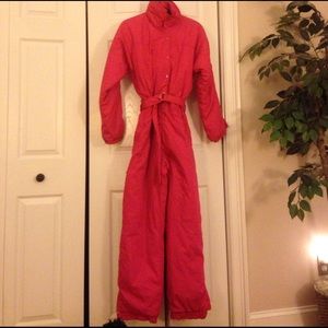 Misses SKI LION hot pink one-piece ski suit.