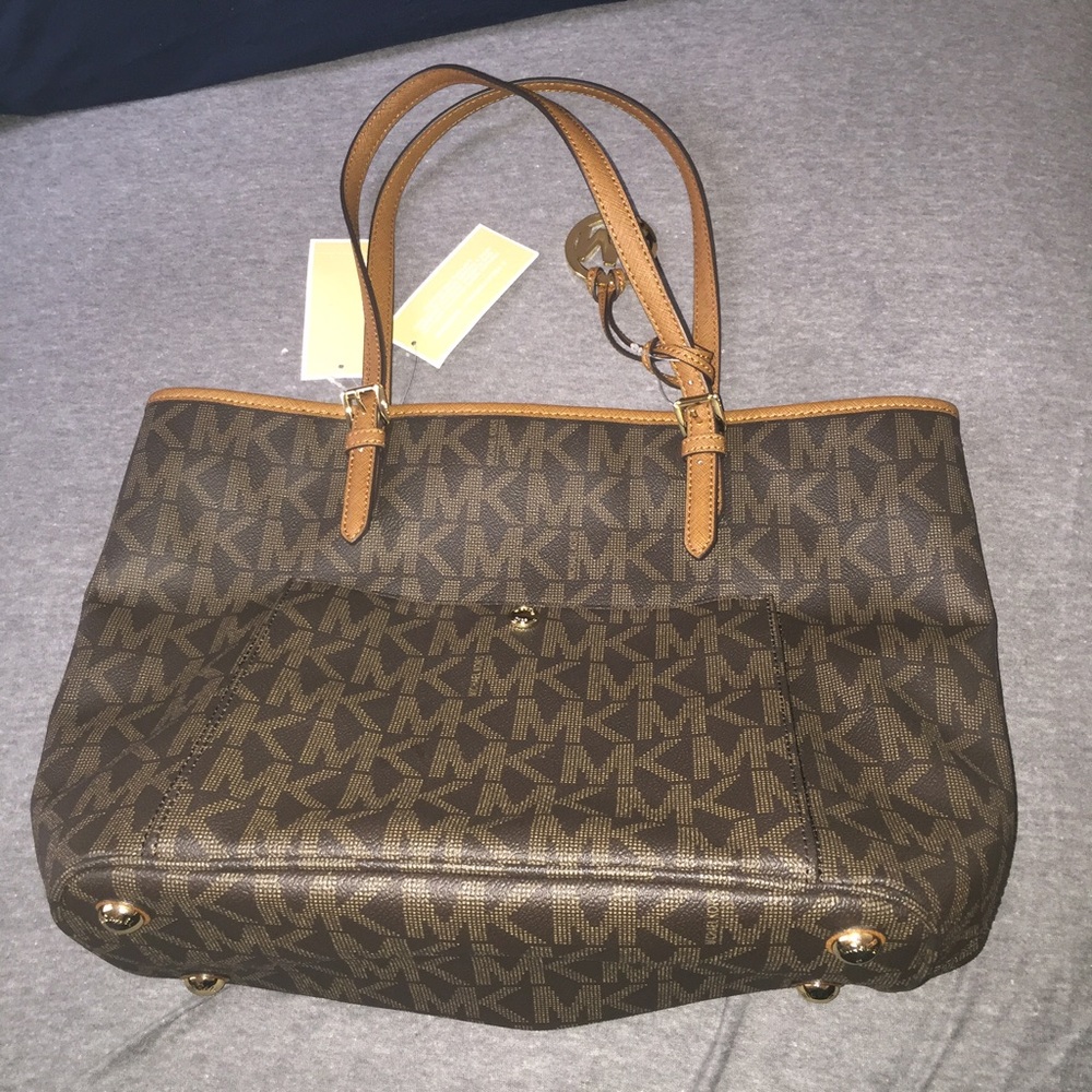 Michael Kors Monogram brown purse