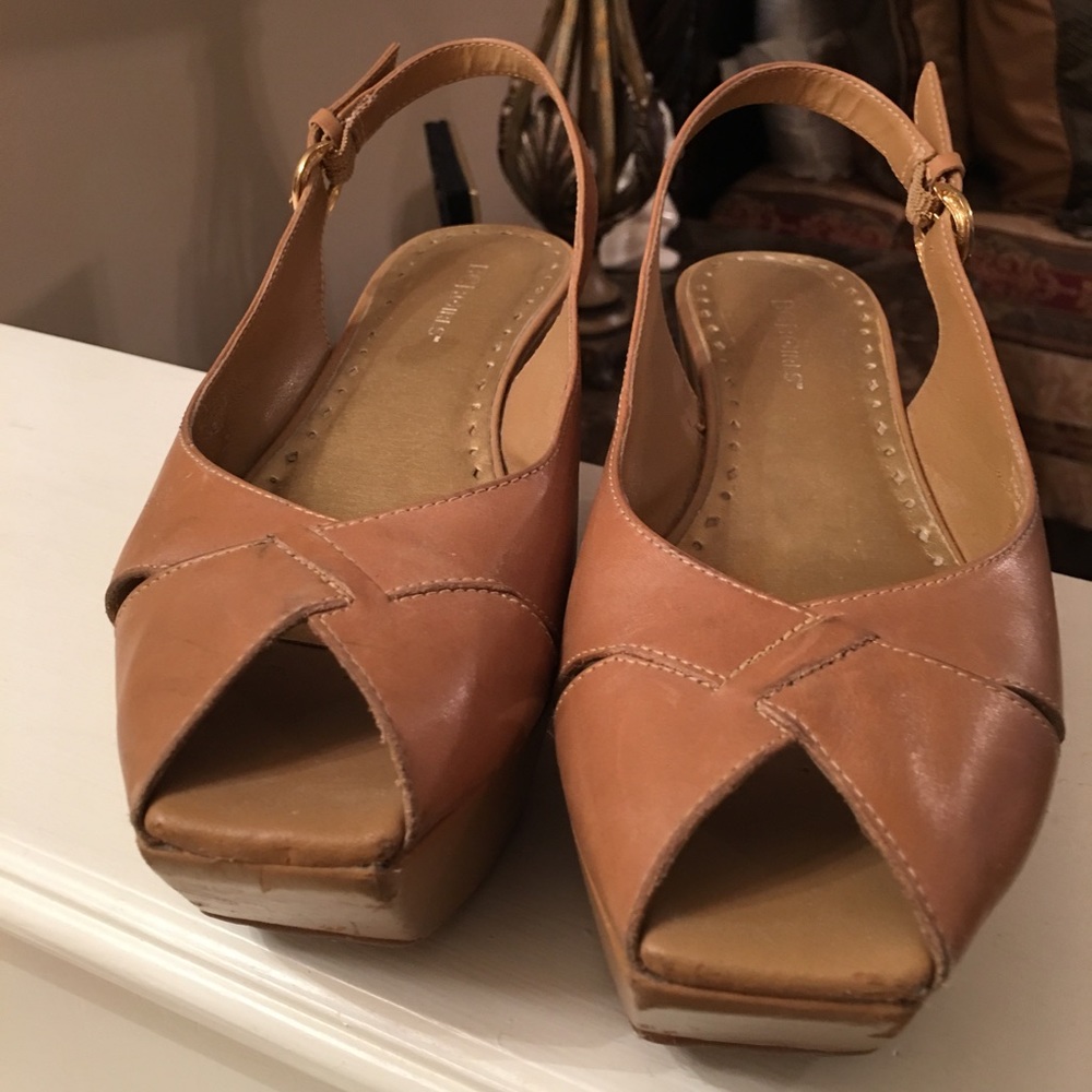 Tan BCBG whole wedge sandal.