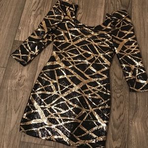 Black and gold sequence dress