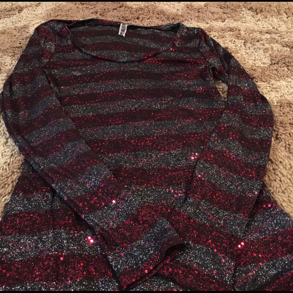 Women's long sleeve sparkle shiny top.