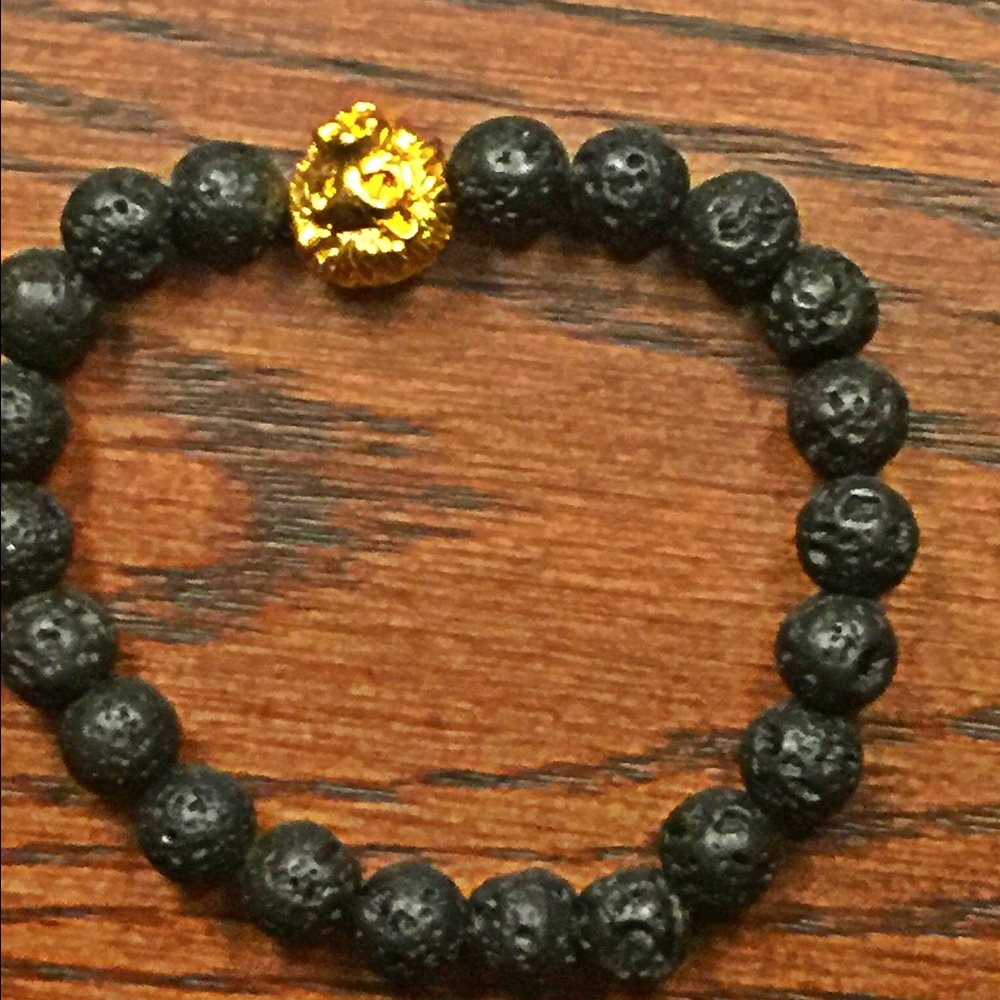 Black lava beaded bracelet with lion center piece