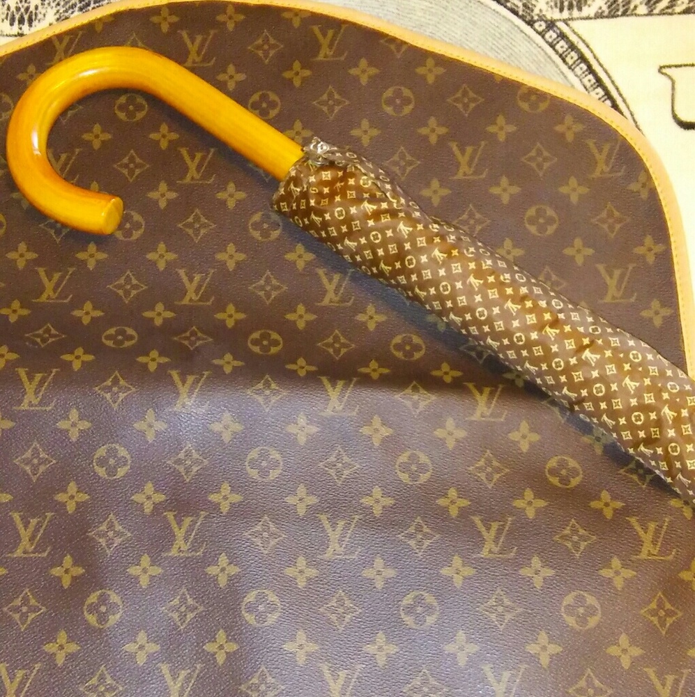 Louis Vuitton  umbrella and single suit carrier.