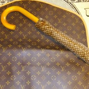 Louis Vuitton  umbrella and single suit carrier.