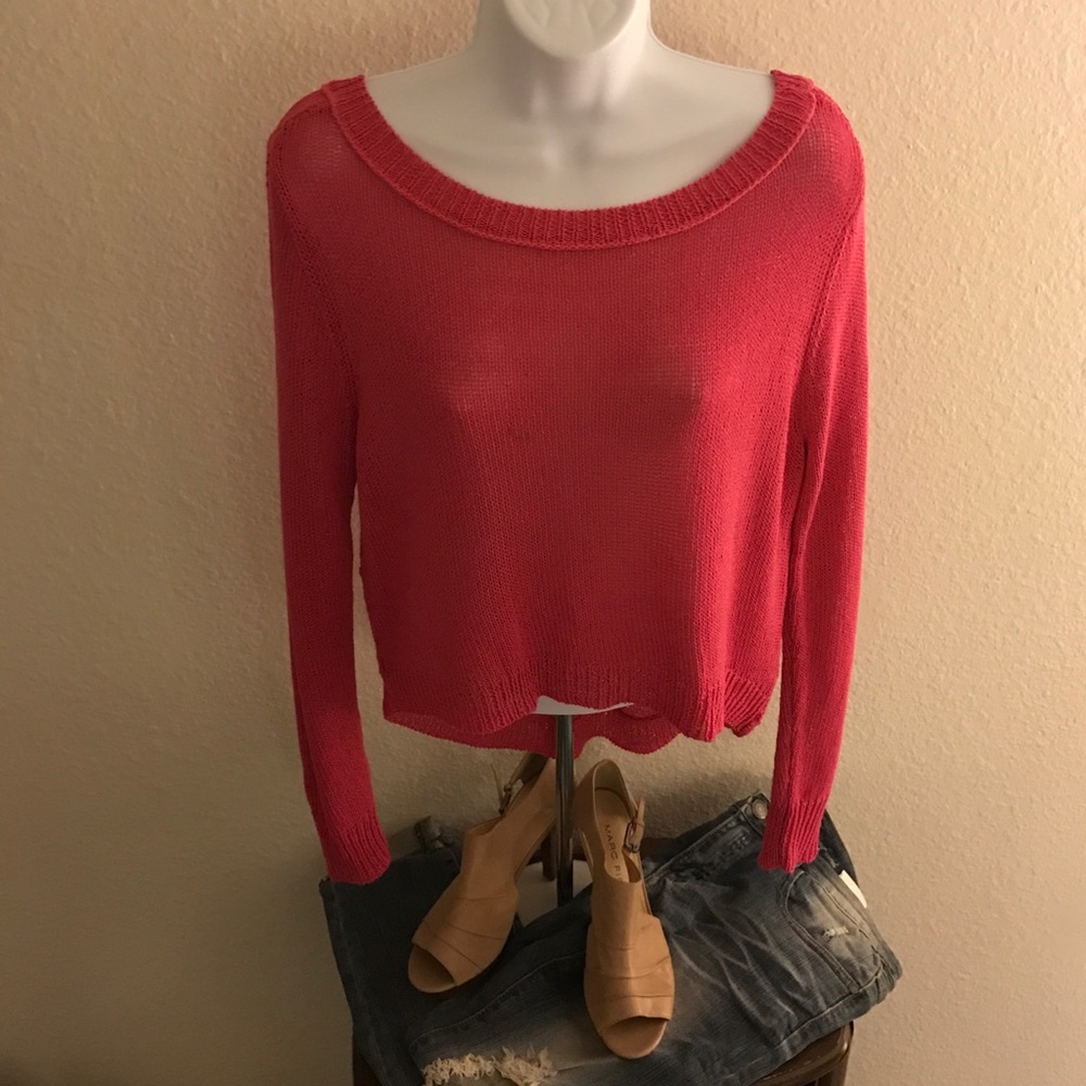 Pink knit sweater by Bisou Bisou.