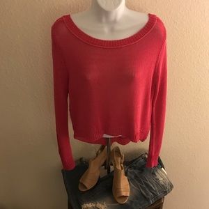 Pink knit sweater by Bisou Bisou.