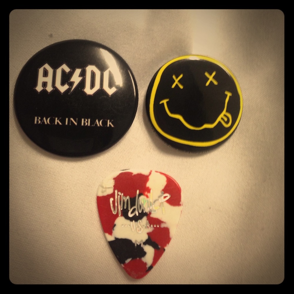 Two band pins and a guitar pic
