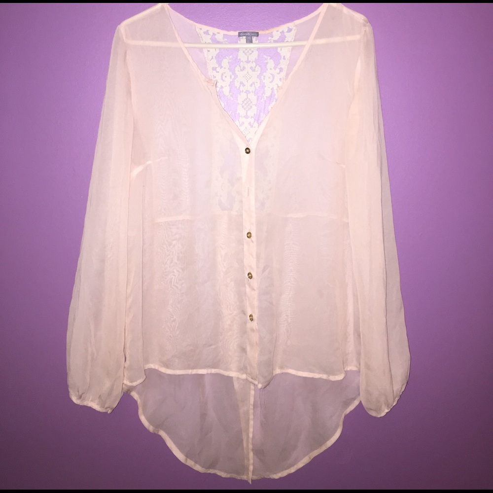 Sheer pale pink blouse.