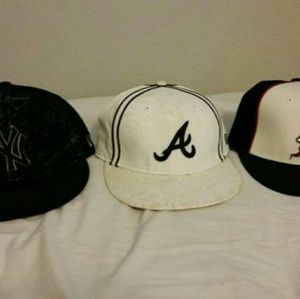 3 hats. Yankees,  Mets,  Braves