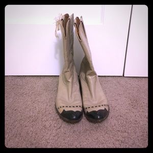 Tan and black cowboy boots