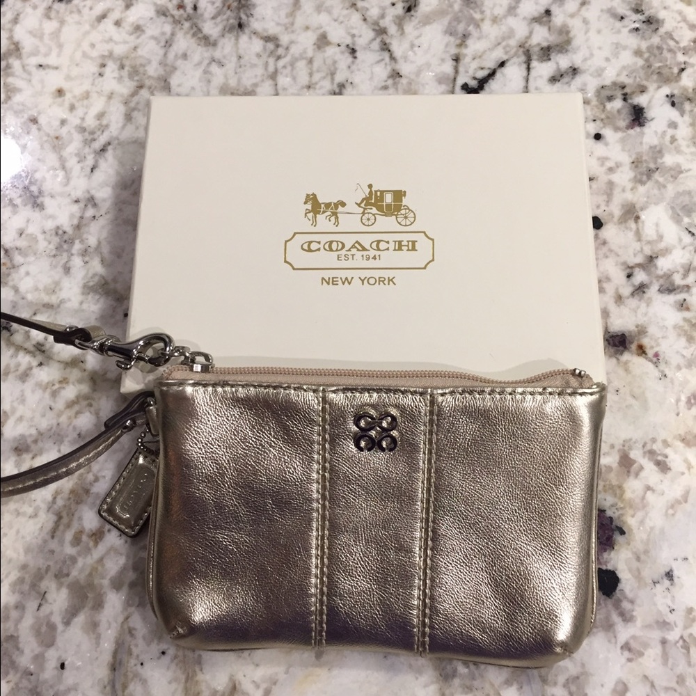 Gold leather Coach wristlet