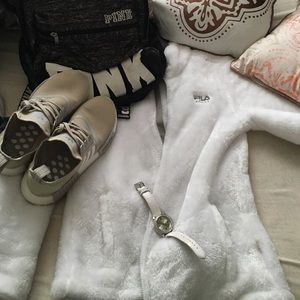 Pink backpack white fila shoes adidas and a watch