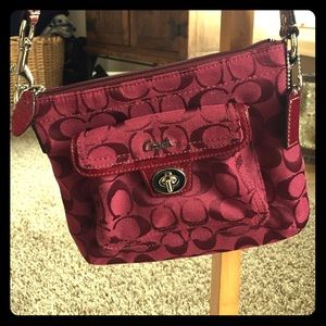 Coach Cross Body Bag. Front pocket with closure.