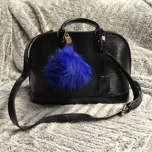 Black alma shaped, epi leather style bag.