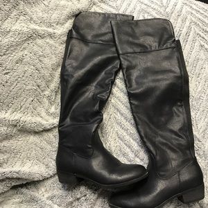 Knee high black boots.