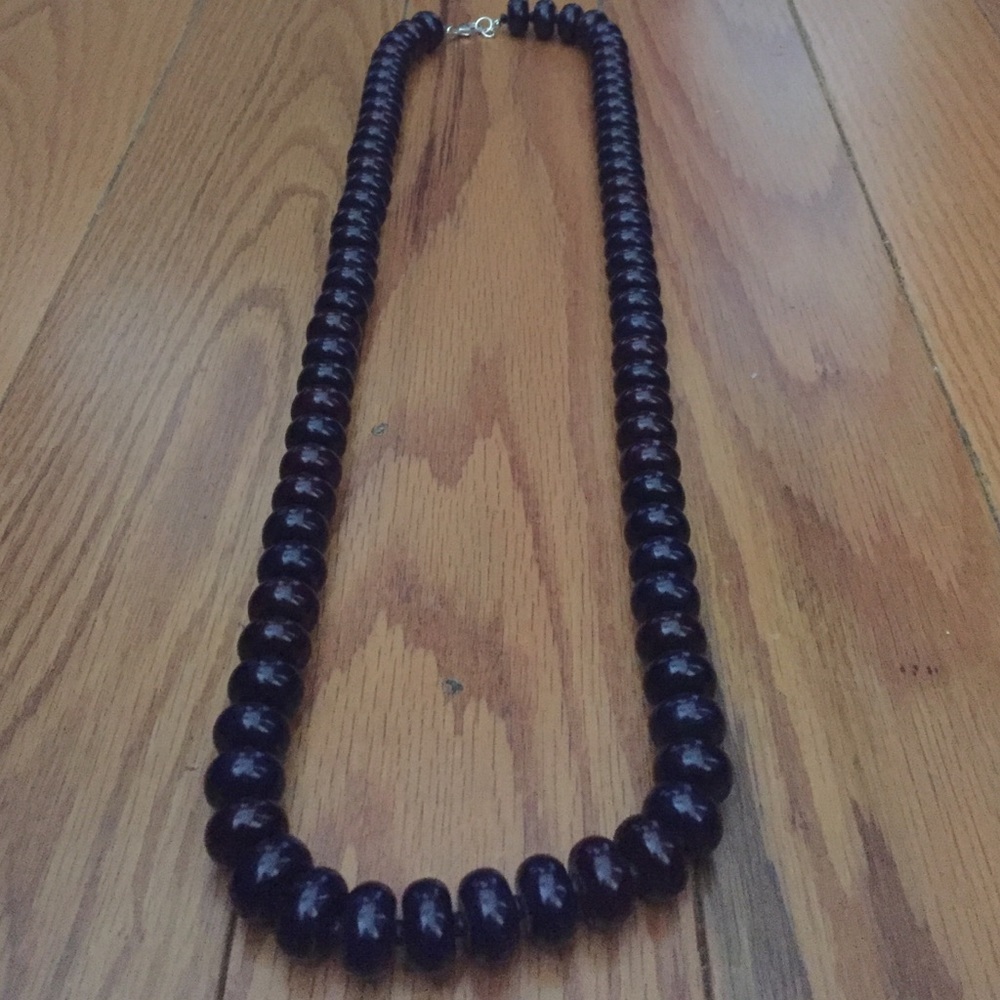 Long navy beaded necklace with silver clasp