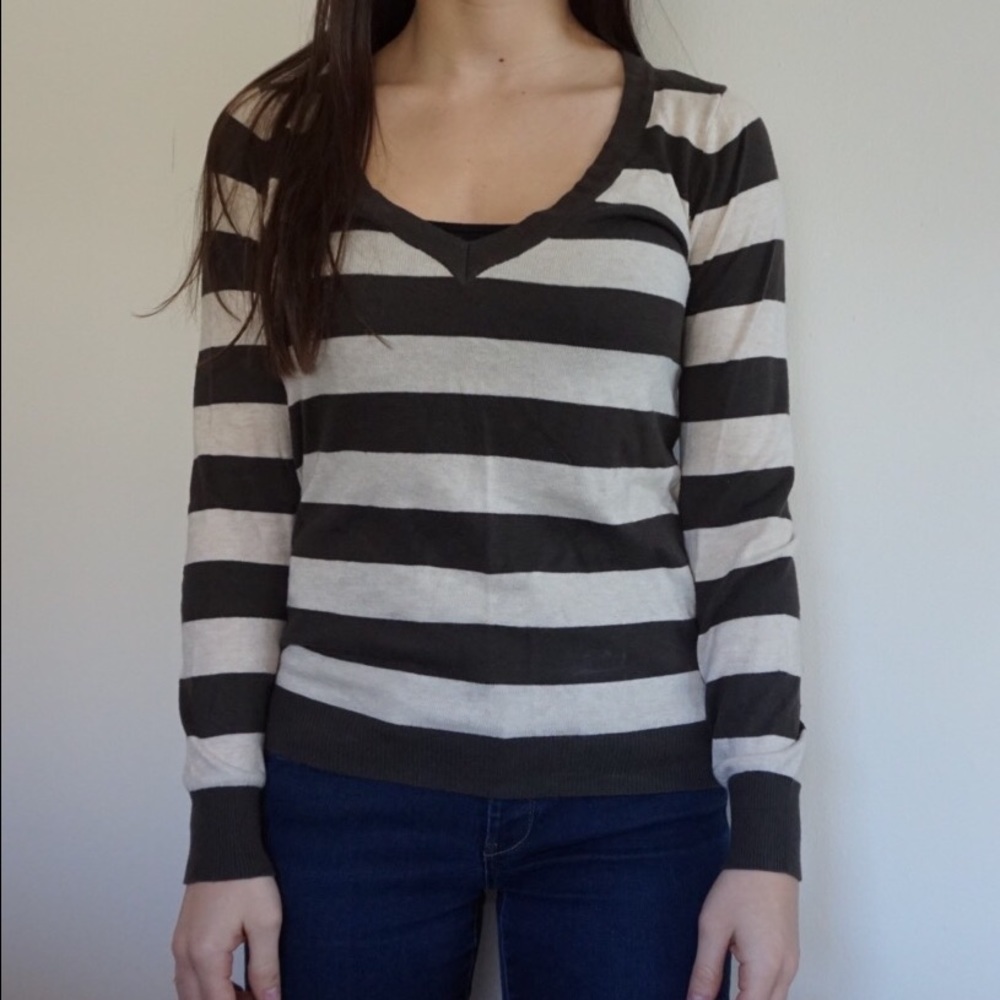 Green and beige striped sweater