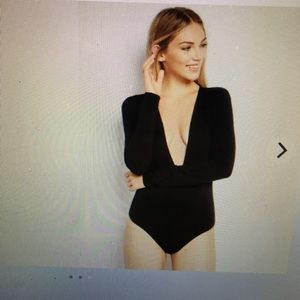 A long sleep, deep cut neck body suit from express